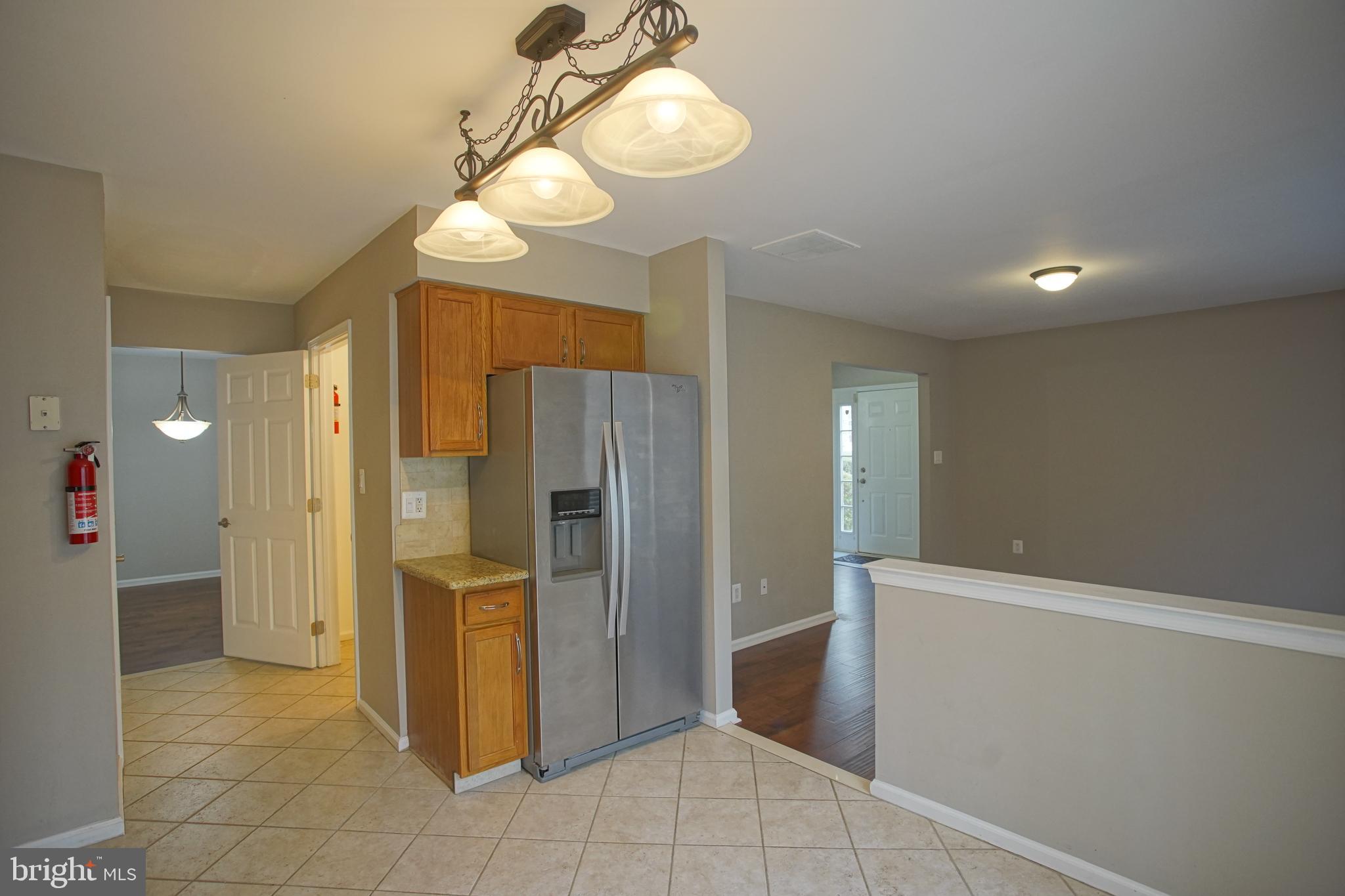 5808 Coventry Way Mount Laurel, NJ 08054 - Photo 13 of 41 a view of a refrigerator in kitchen and a window