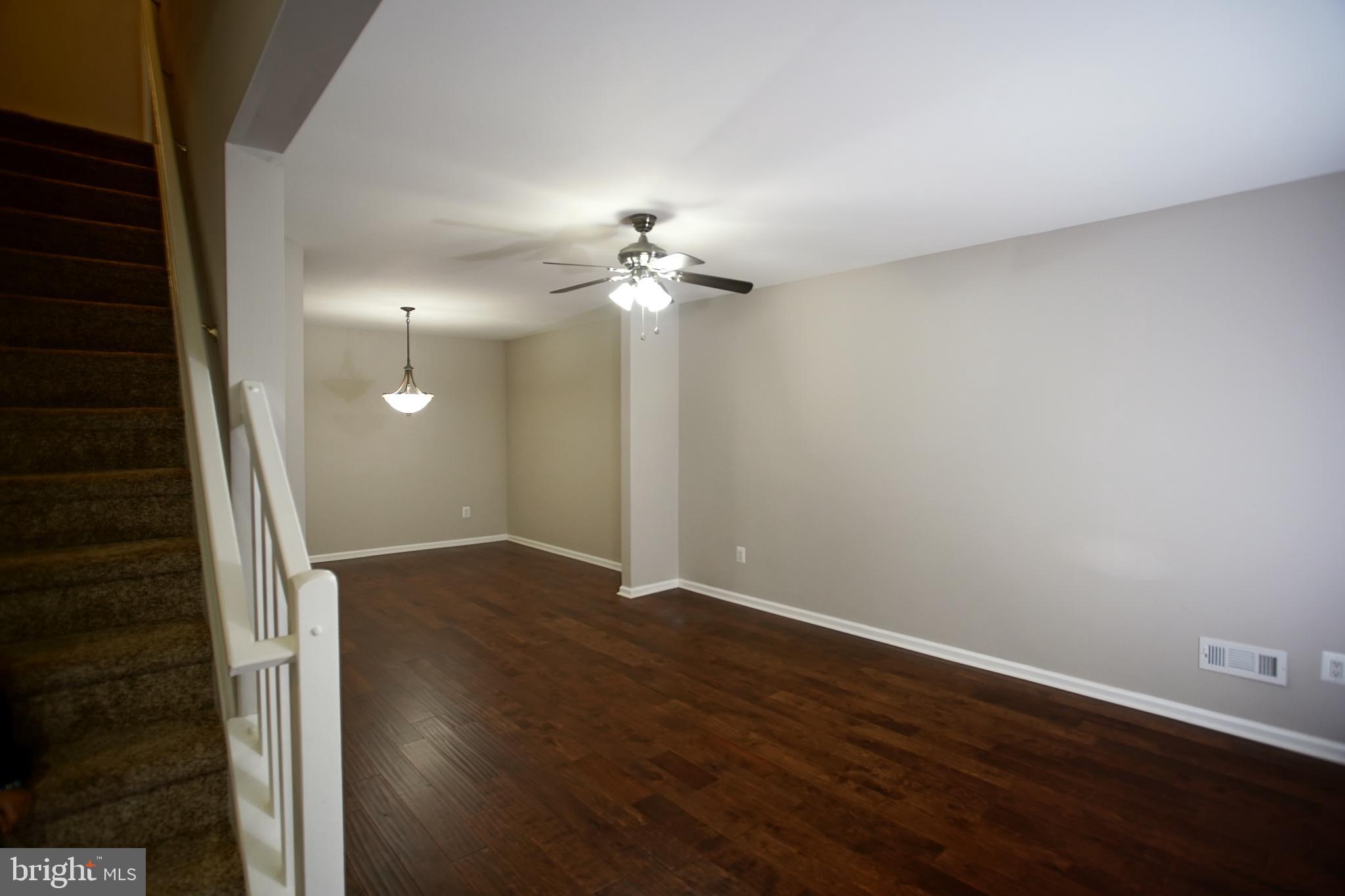 5808 Coventry Way Mount Laurel, NJ 08054 - Photo 19 of 41 a view of a room with wooden floor and a ceiling fan