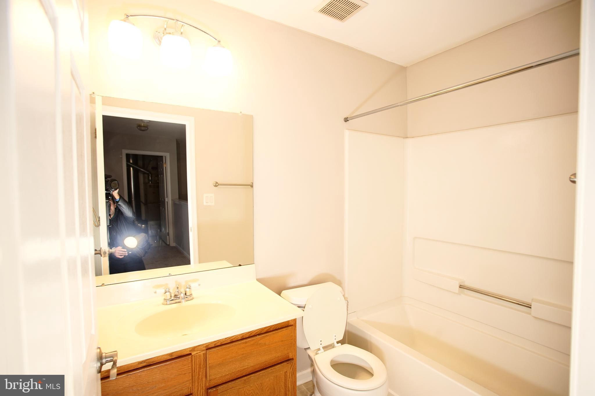 5808 Coventry Way Mount Laurel, NJ 08054 - Photo 32 of 41 a bathroom with a sink a toilet and shower