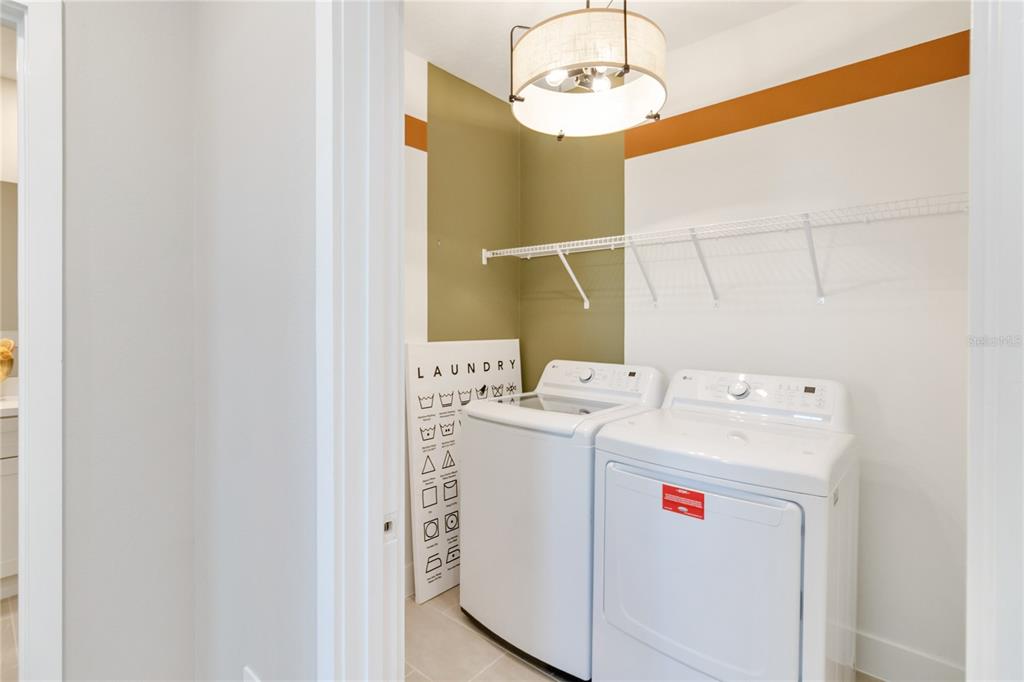2422 Magnolia Reserve Road Ocoee, FL 34761 - Photo 25 of 29 a utility room with dryer and washer