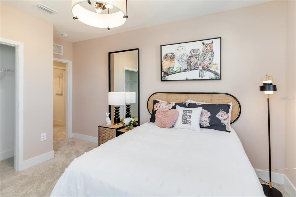 2422 Magnolia Reserve Road Ocoee, FL 34761 - Photo 29 of 29 a bedroom with bed and a painting on the wall