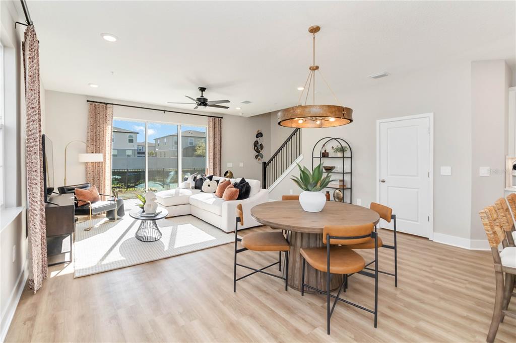 2422 Magnolia Reserve Road Ocoee, FL 34761 - Photo 6 of 29 a living room with dining table