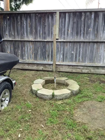 a view of a house with a backyard and a car parked