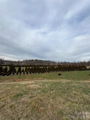 a view of a field with ocean view