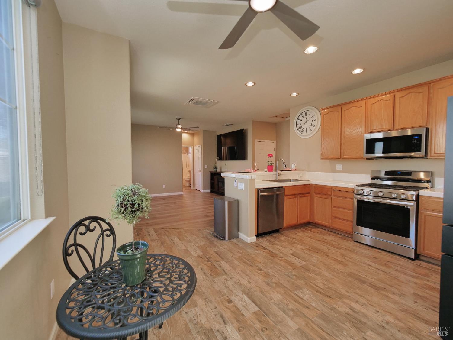 773 Turnberry Terrace Rio Vista, CA 94571 - Photo 14 of 52 a kitchen with a sink stainless steel appliances and white cabinets