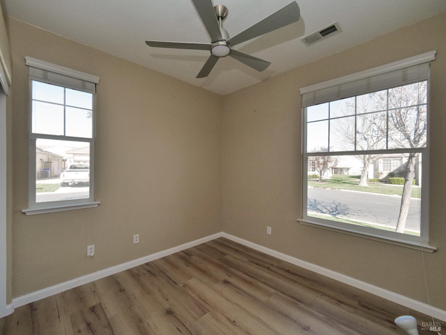 773 Turnberry Terrace Rio Vista, CA 94571 - Photo 18 of 52 a view of an empty room with a window and wooden floor