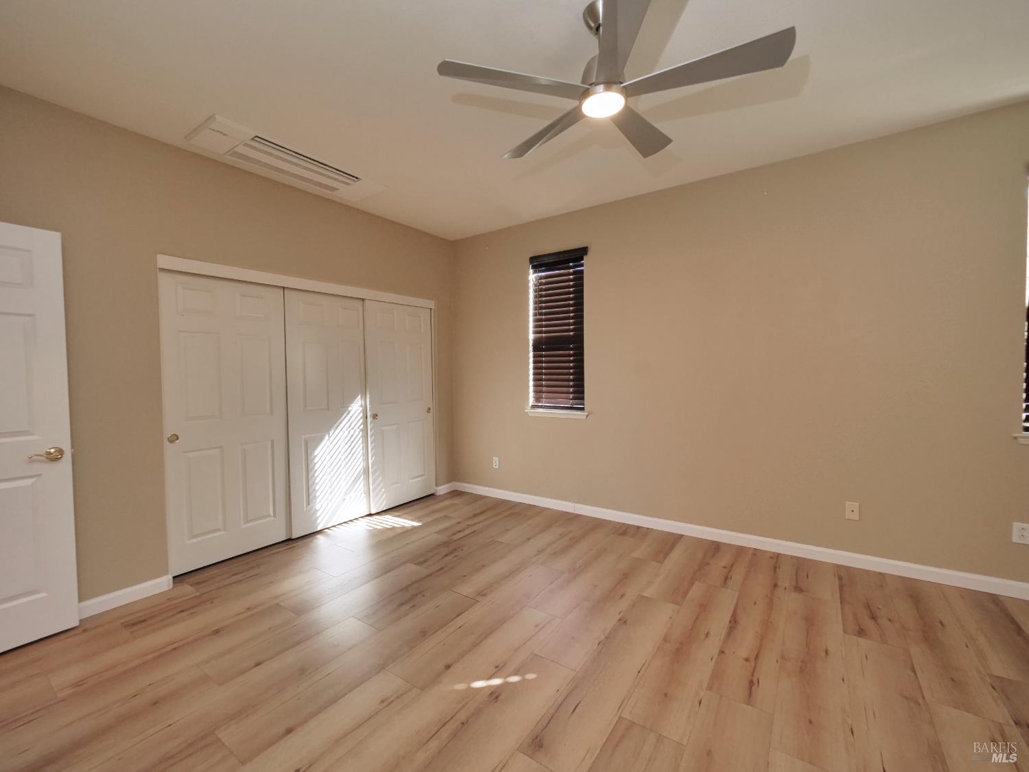 773 Turnberry Terrace Rio Vista, CA 94571 - Photo 22 of 52 an empty room with wooden floor and windows