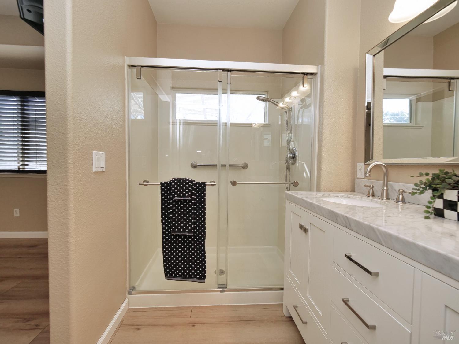 773 Turnberry Terrace Rio Vista, CA 94571 - Photo 24 of 52 a bathroom with a shower sink and mirror