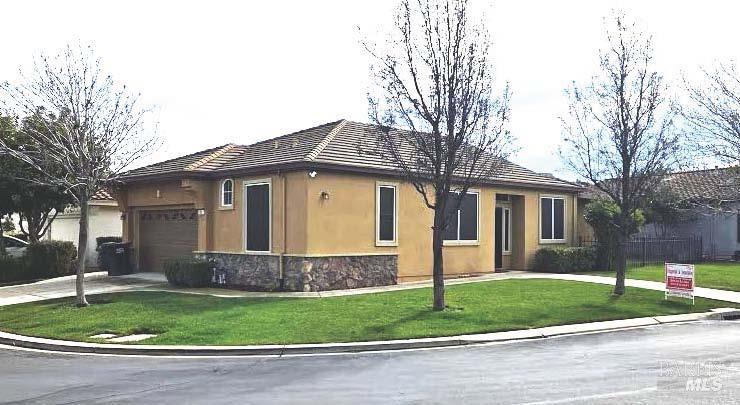 773 Turnberry Terrace Rio Vista, CA 94571 - Photo 3 of 52 a front view of a house with a garden and trees