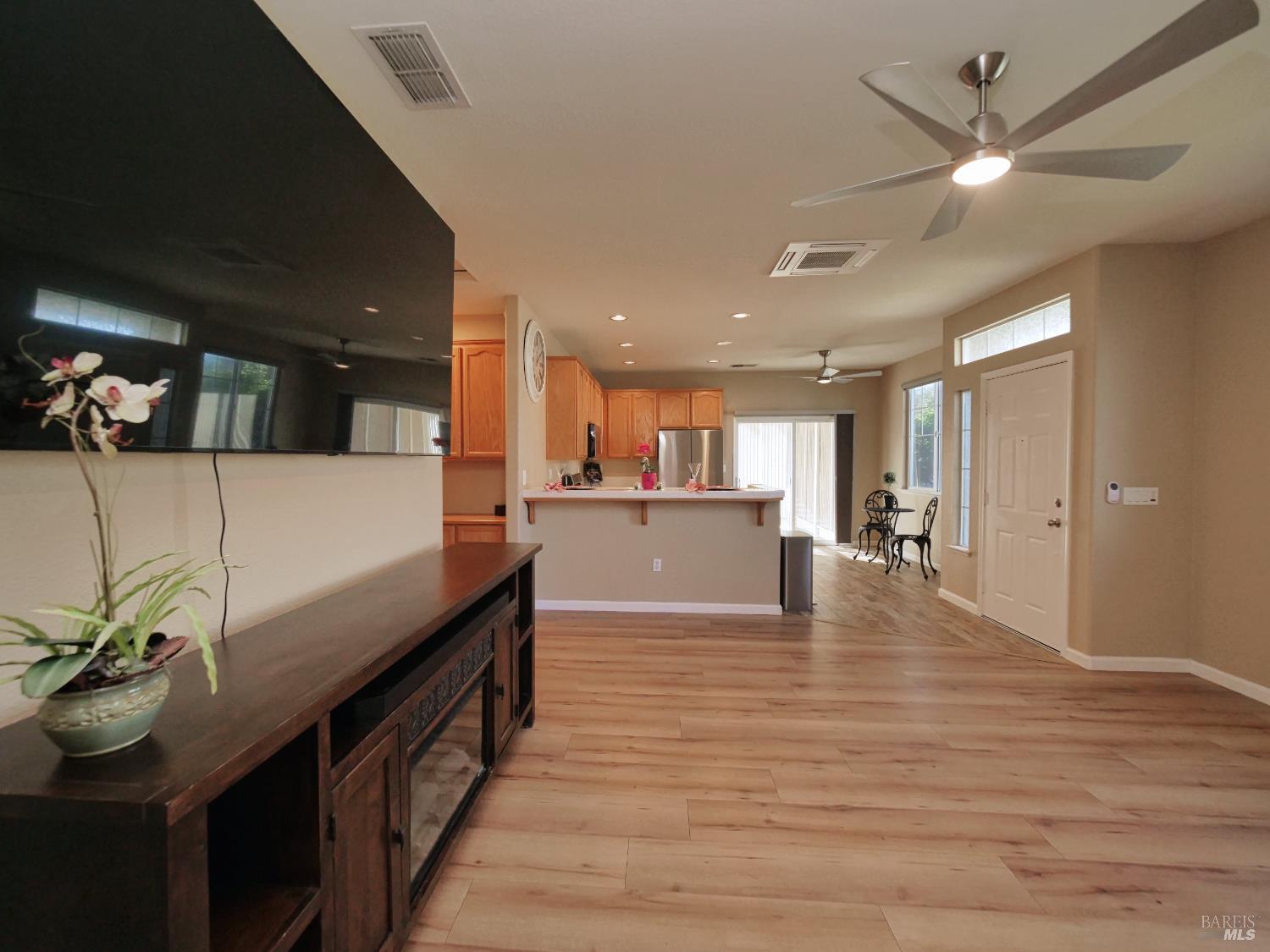 773 Turnberry Terrace Rio Vista, CA 94571 - Photo 8 of 52 a view of a living room and kitchen with a flat screen tv