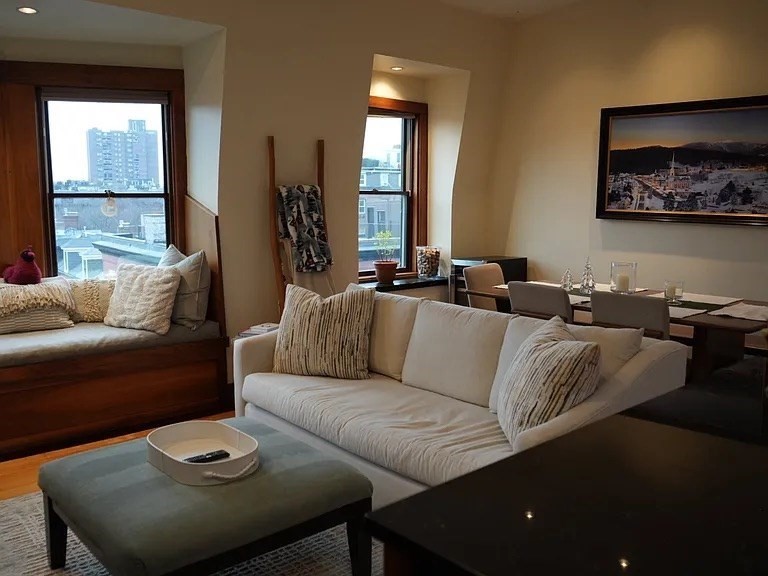 11 Milford Street, Unit 4 Boston, MA 02118 - Photo 4 of 22 a living room with furniture and a large window