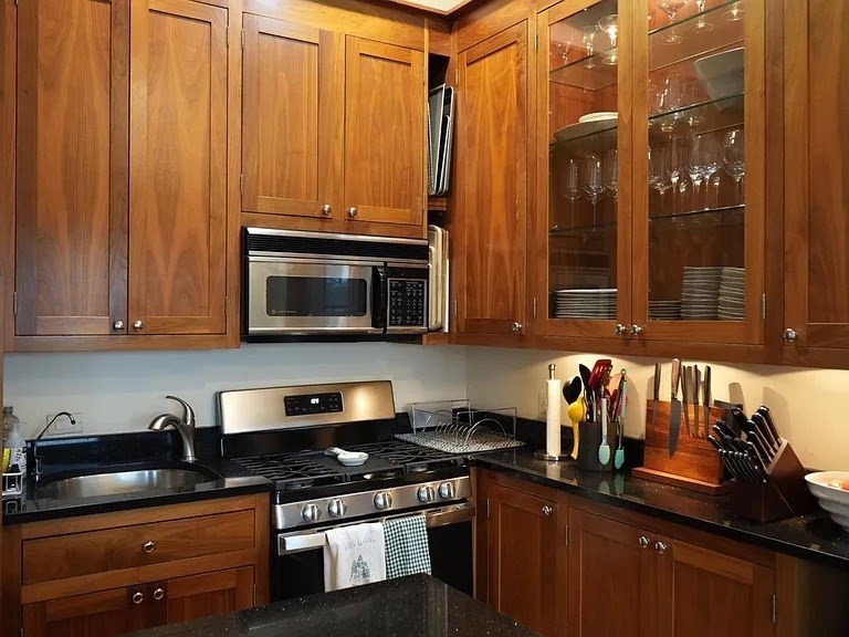 11 Milford Street, Unit 4 Boston, MA 02118 - Photo 8 of 22 a kitchen with stainless steel appliances a stove a sink and a microwave