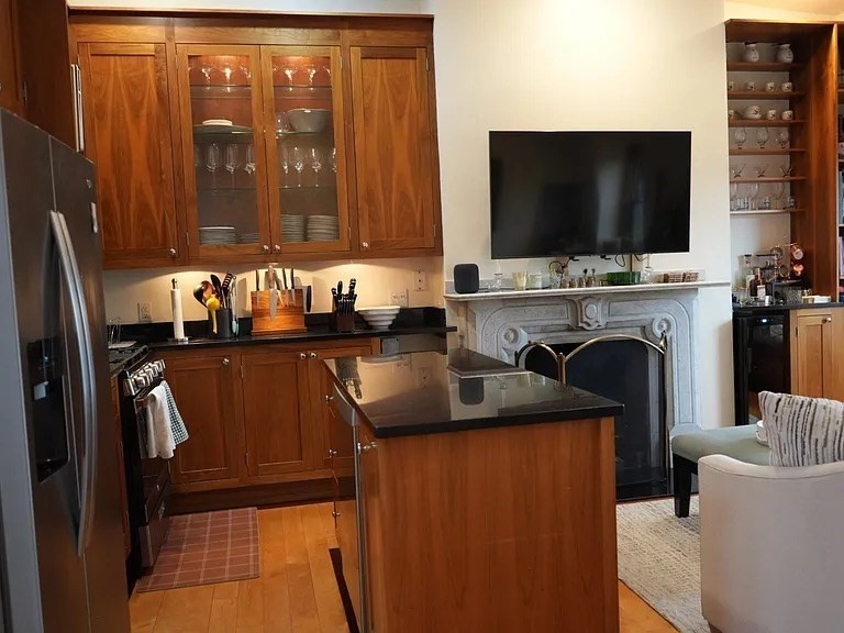 11 Milford Street, Unit 4 Boston, MA 02118 - Photo 10 of 22 a kitchen with a refrigerator and a sink