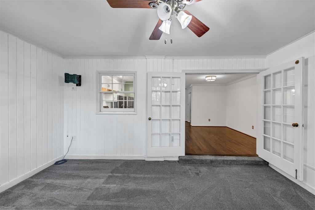 144 Woodmere Square Northwest Atlanta, GA 30327 - Photo 14 of 43 a view of empty room with windows