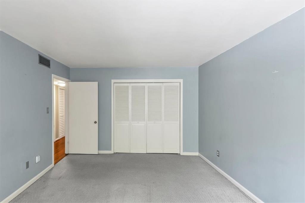 144 Woodmere Square Northwest Atlanta, GA 30327 - Photo 16 of 43 an empty room with window