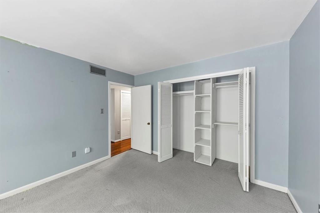 144 Woodmere Square Northwest Atlanta, GA 30327 - Photo 17 of 43 a view of an empty room