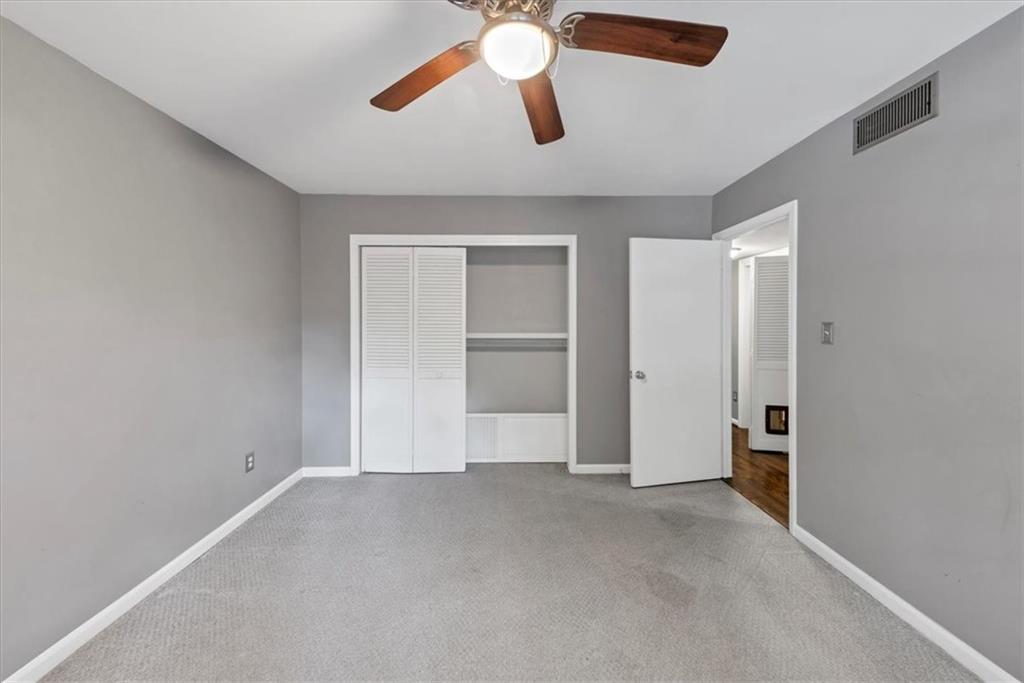 144 Woodmere Square Northwest Atlanta, GA 30327 - Photo 22 of 43 a view of empty room with ceiling fan