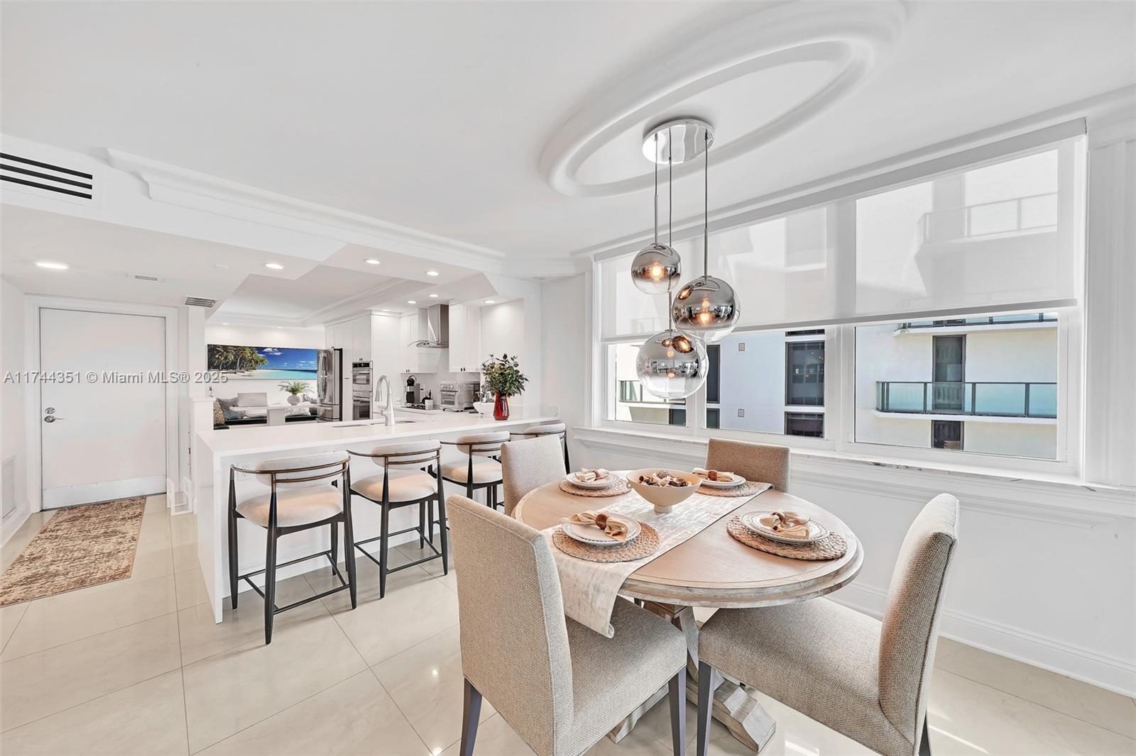 1012 North Ocean Boulevard, Unit 701 Pompano Beach, FL 33062 - Photo 11 of 57 a view of a dining room and livingroom view
