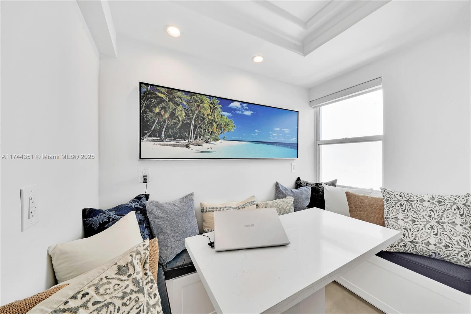 1012 North Ocean Boulevard, Unit 701 Pompano Beach, FL 33062 - Photo 14 of 57 a living room with furniture and a large window