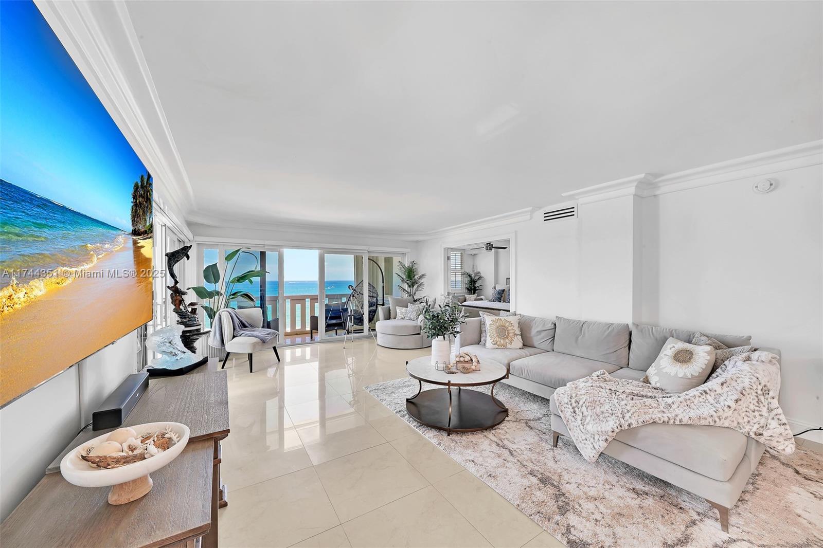 1012 North Ocean Boulevard, Unit 701 Pompano Beach, FL 33062 - Photo 25 of 57 a living room with furniture and a window