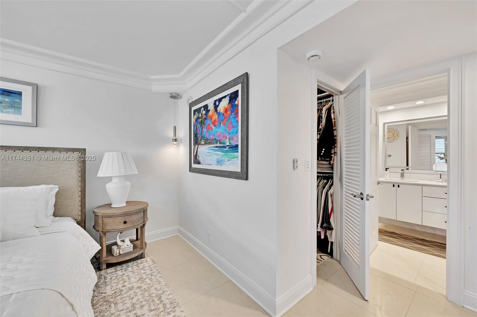 1012 North Ocean Boulevard, Unit 701 Pompano Beach, FL 33062 - Photo 29 of 57 a bedroom with a bed and furniture