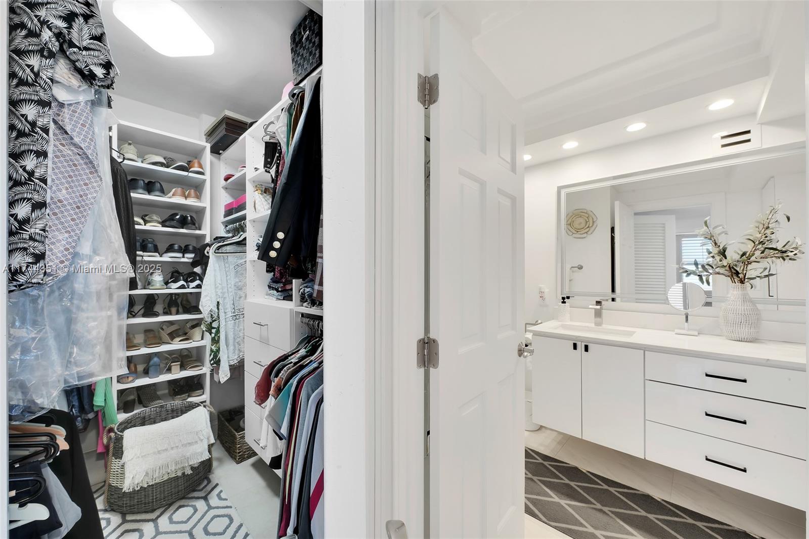 1012 North Ocean Boulevard, Unit 701 Pompano Beach, FL 33062 - Photo 31 of 57 a view of walk in closet with clothes and shoes