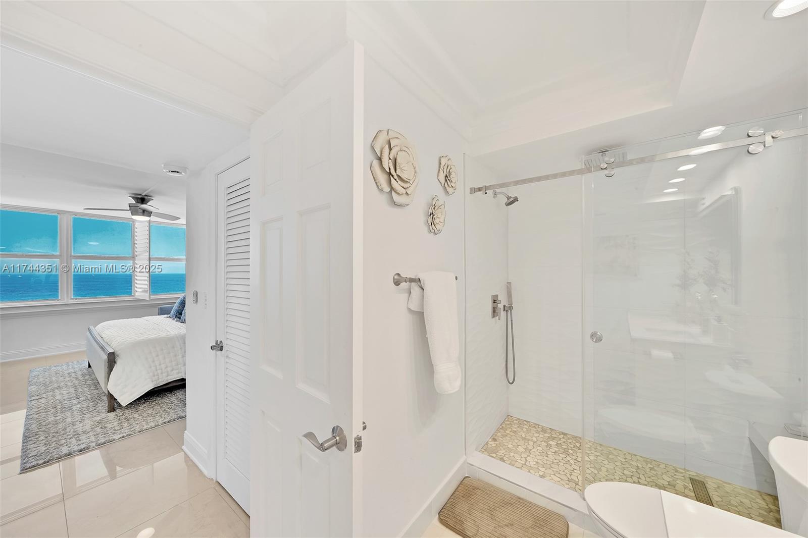 1012 North Ocean Boulevard, Unit 701 Pompano Beach, FL 33062 - Photo 33 of 57 a bathroom with a sink toilet and shower