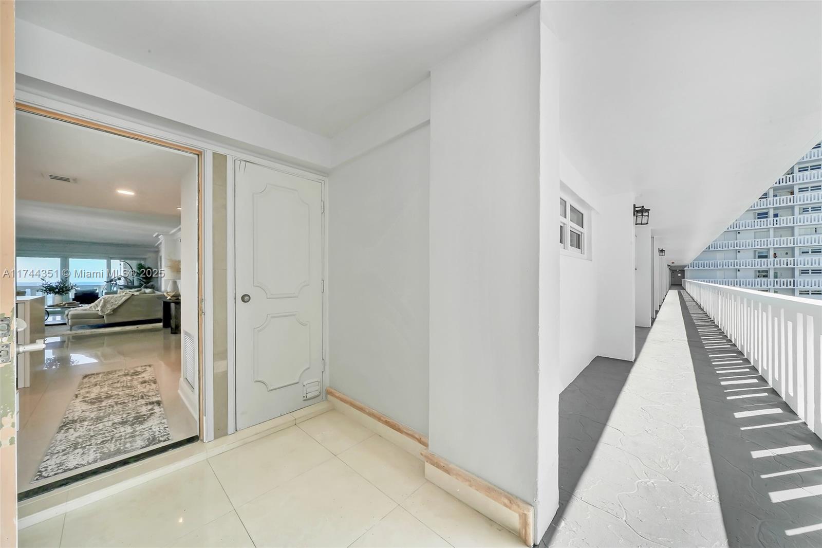 1012 North Ocean Boulevard, Unit 701 Pompano Beach, FL 33062 - Photo 42 of 57 a view of a hallway view with three rooms and living room