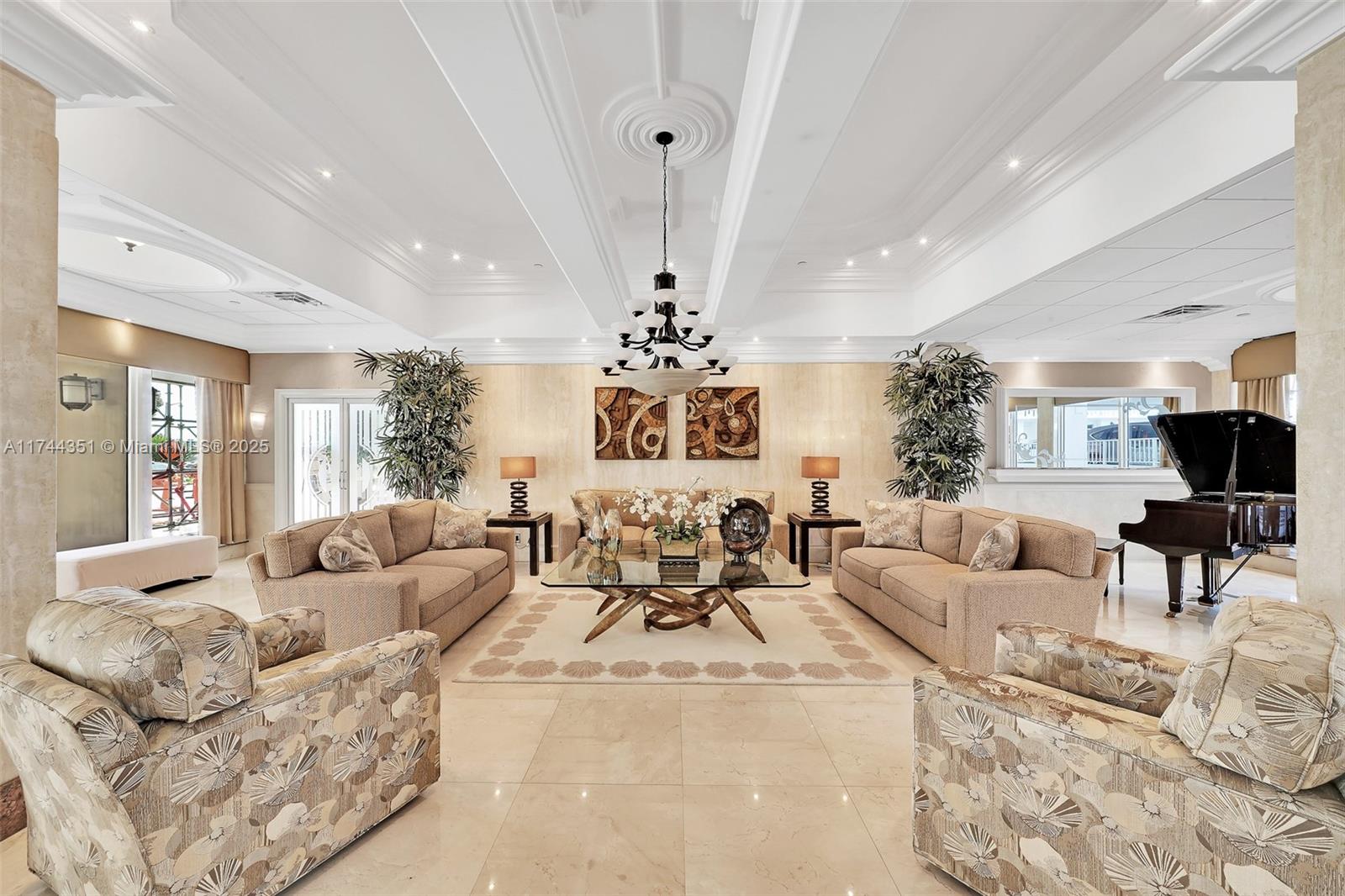 1012 North Ocean Boulevard, Unit 701 Pompano Beach, FL 33062 - Photo 46 of 57 a living room with furniture or chandelier and a fireplace