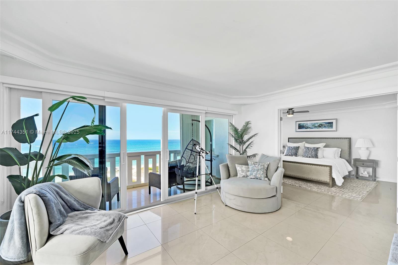 1012 North Ocean Boulevard, Unit 701 Pompano Beach, FL 33062 - Photo 6 of 57 a living room with furniture and a potted plant
