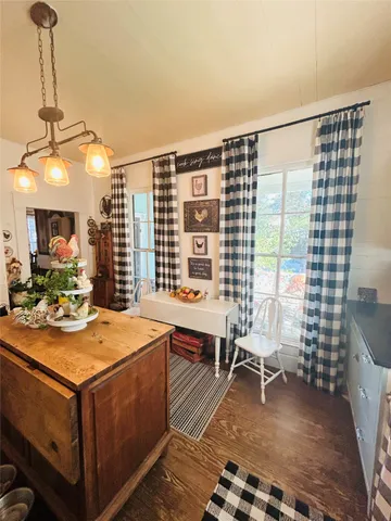 a view of a livingroom with furniture and window