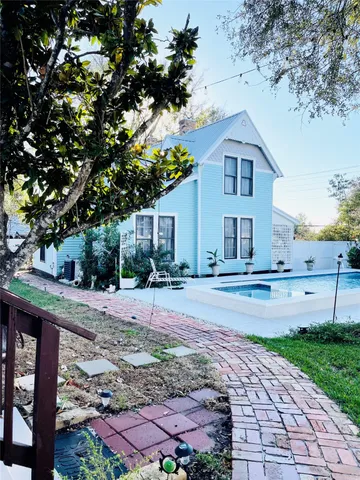a front view of a house with garden
