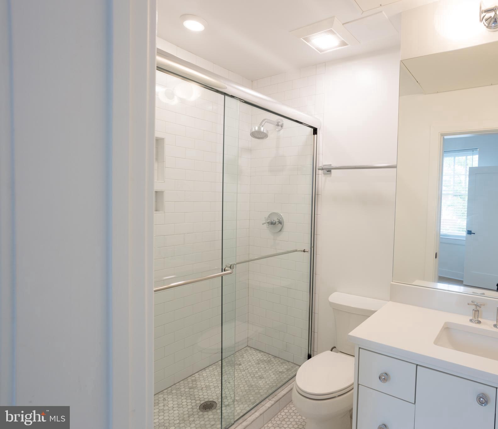 2869 28th Street Northwest, Unit 3 Washington, DC 20008 - Photo 4 of 14 a bathroom with a shower a toilet and sink