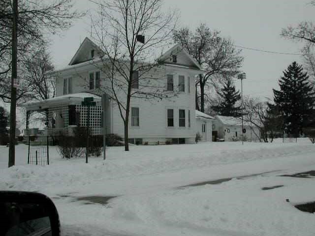 109 Adams Street Ridott, IL 61067 - Photo 5 of 5 a view of a house with a snow on the road