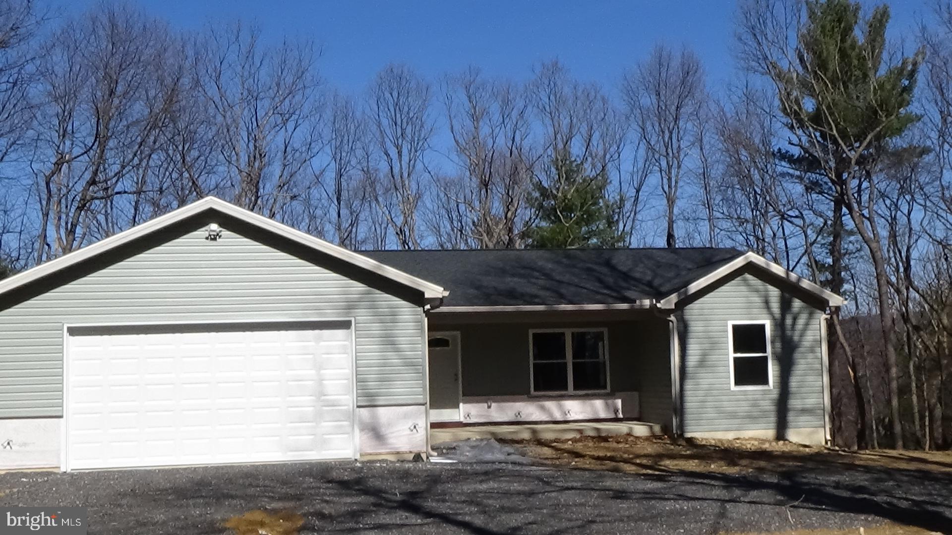 746 Hilltop Road Millerstown, PA 17062 - Photo 24 of 24 a front view of a house with a yard and garage