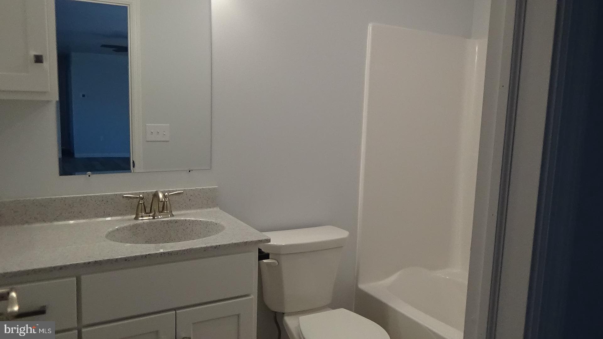 746 Hilltop Road Millerstown, PA 17062 - Photo 10 of 24 a bathroom with a sink toilet and a mirror