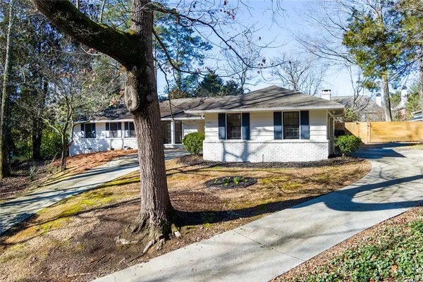 a front view of house with yard swimming pool and outdoor seating