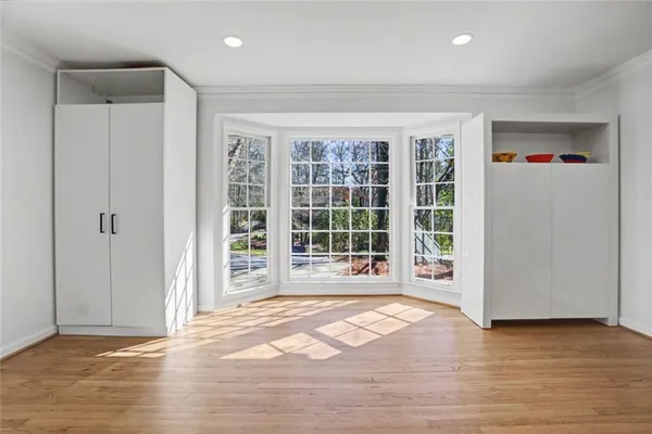 a view of a dining room with furniture window and wooden floor