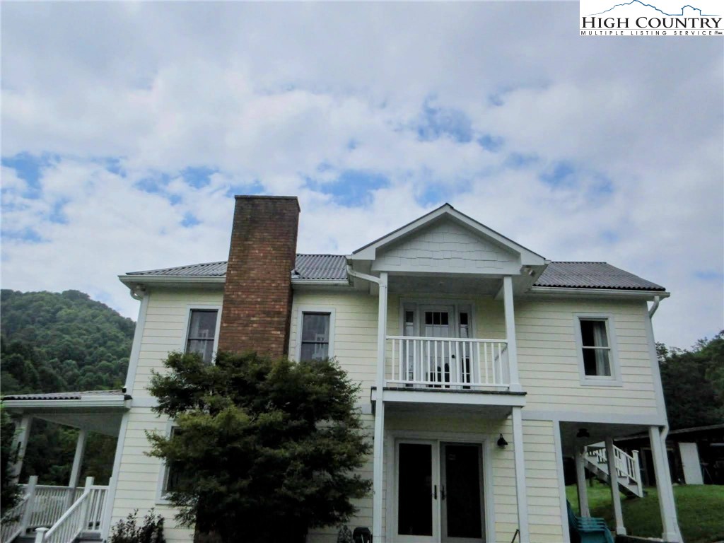 1294 Spencer Branch Road Lansing, NC 28643 - Photo 22 of 42 a front view of house with yard and trees around