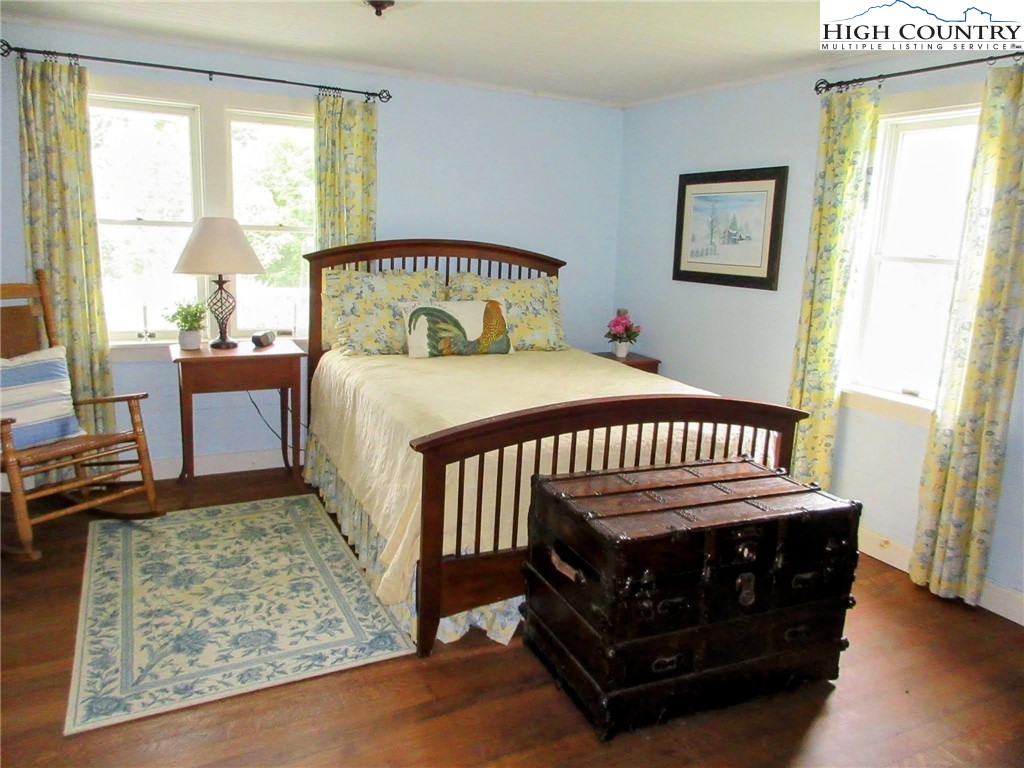 1294 Spencer Branch Road Lansing, NC 28643 - Photo 4 of 42 a bedroom with a bed window and a table in it