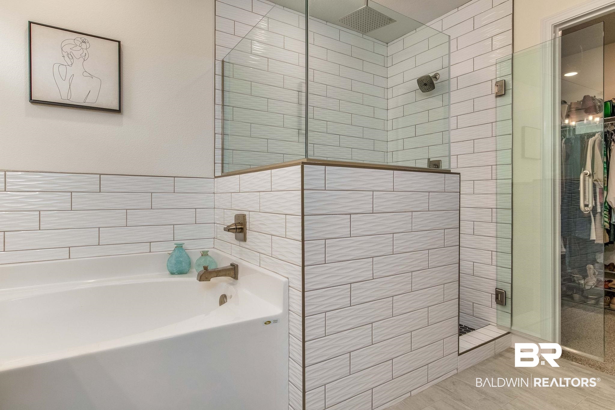 2222 Club House Drive Lillian, AL 36549 - Photo 14 of 49 Full bathroom with a stall shower, a garden tub, a spacious closet, and tile walls