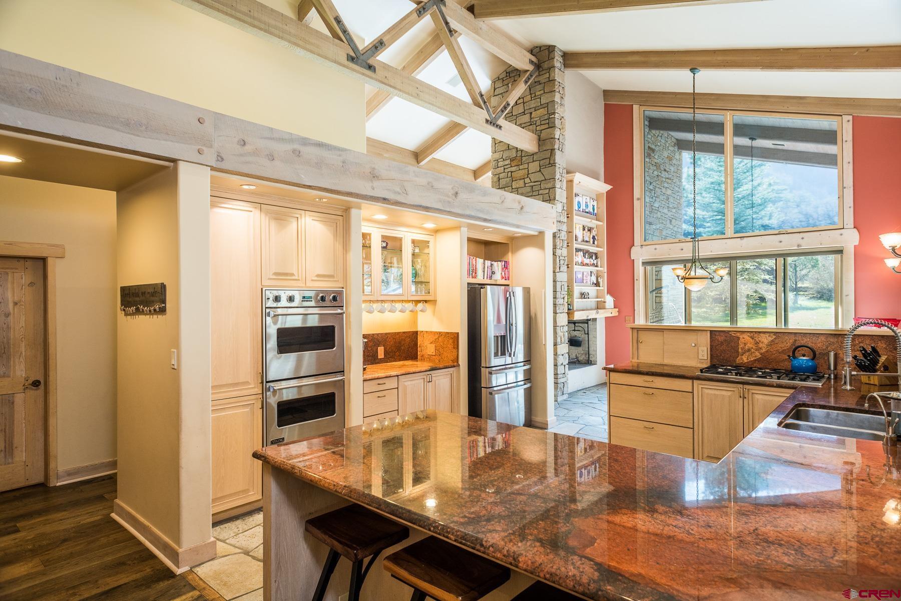 47 Mason Cabin Road Durango, CO 81301 - Photo 15 of 35 a view of a dining room with furniture window and wooden floor