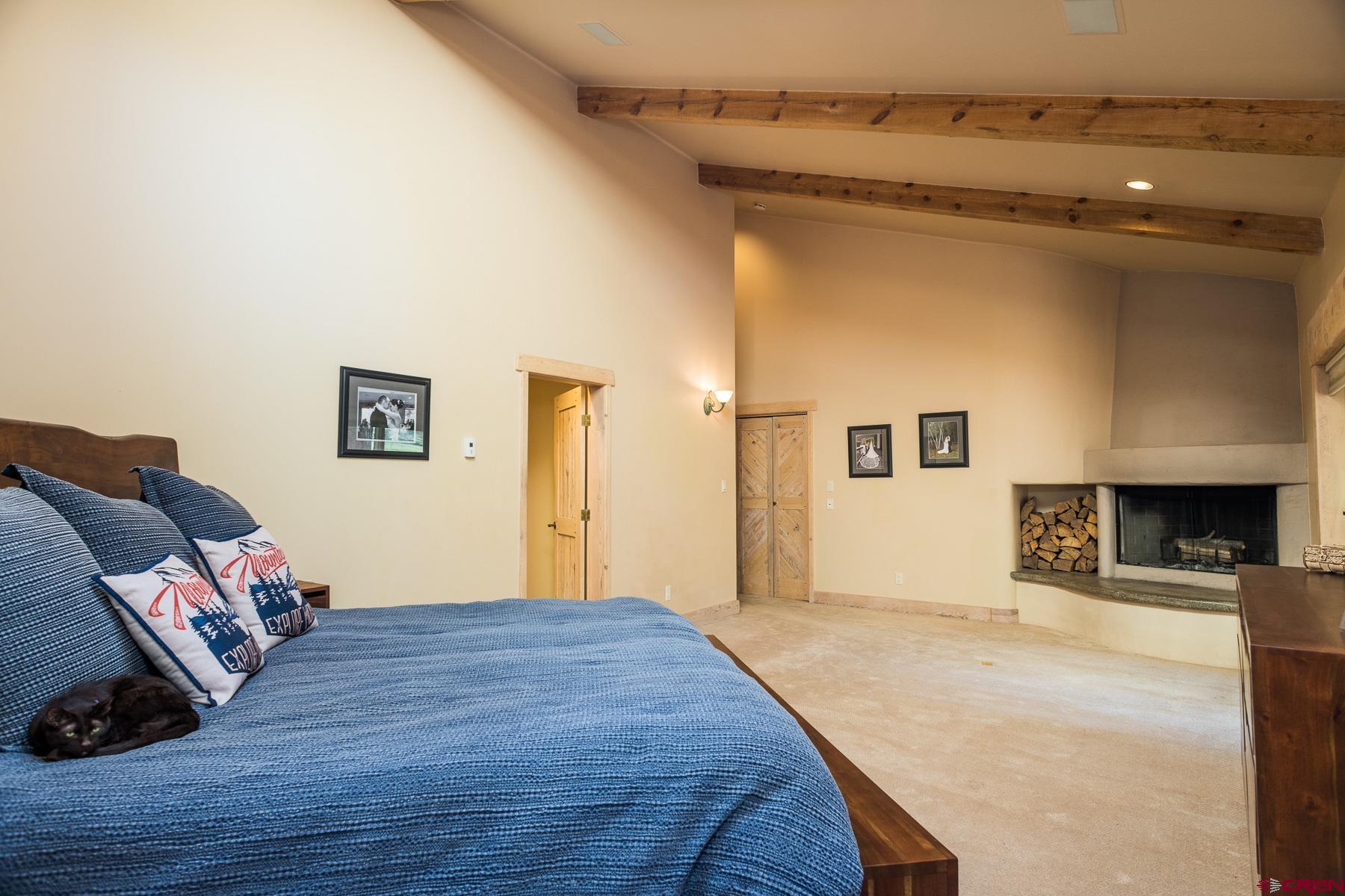 47 Mason Cabin Road Durango, CO 81301 - Photo 19 of 35 a bed room with a bed and a couch