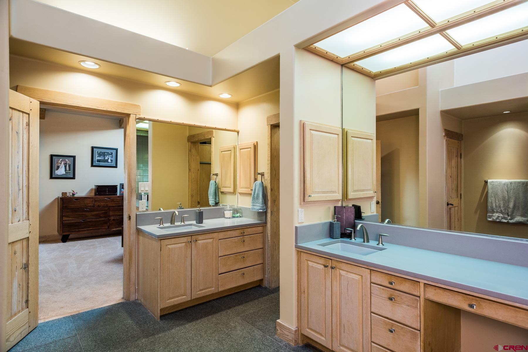 47 Mason Cabin Road Durango, CO 81301 - Photo 20 of 35 a bathroom with a double vanity sink mirror and