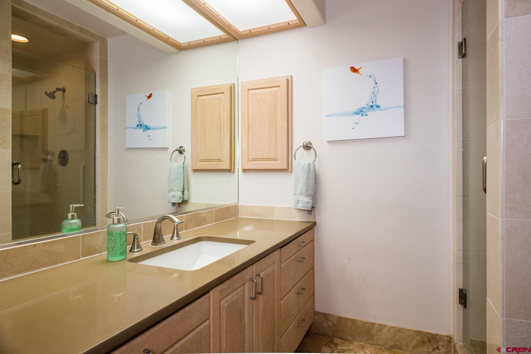 47 Mason Cabin Road Durango, CO 81301 - Photo 21 of 35 a bathroom with a sink and a mirror