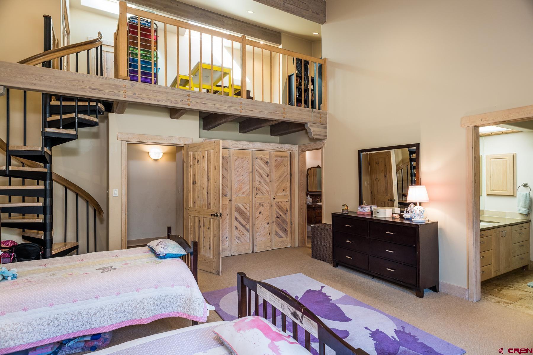 47 Mason Cabin Road Durango, CO 81301 - Photo 26 of 35 a bedroom with a bed and a dresser