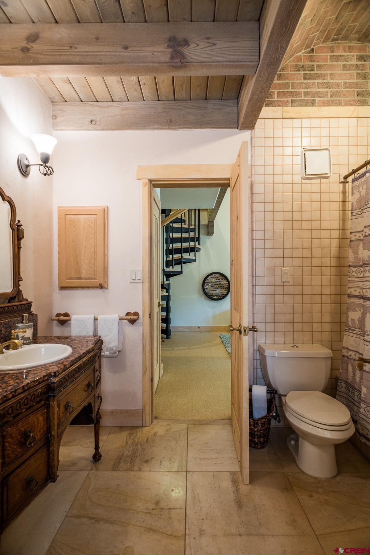 47 Mason Cabin Road Durango, CO 81301 - Photo 28 of 35 a bathroom with a sink toilet and shower