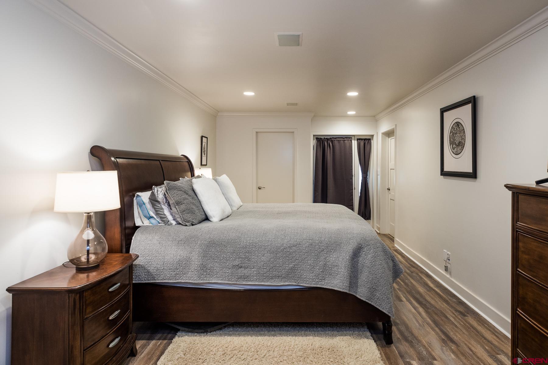 47 Mason Cabin Road Durango, CO 81301 - Photo 31 of 35 a bedroom with a bed and a night stand