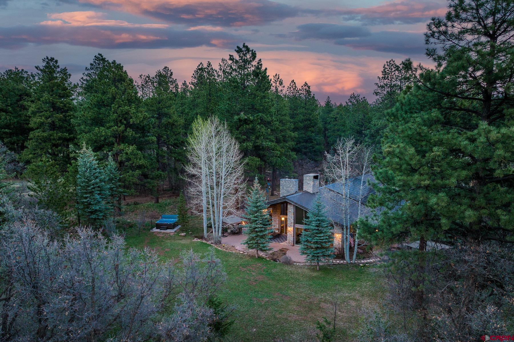 47 Mason Cabin Road Durango, CO 81301 - Photo 33 of 35 a view of a big house with a big yard and large trees