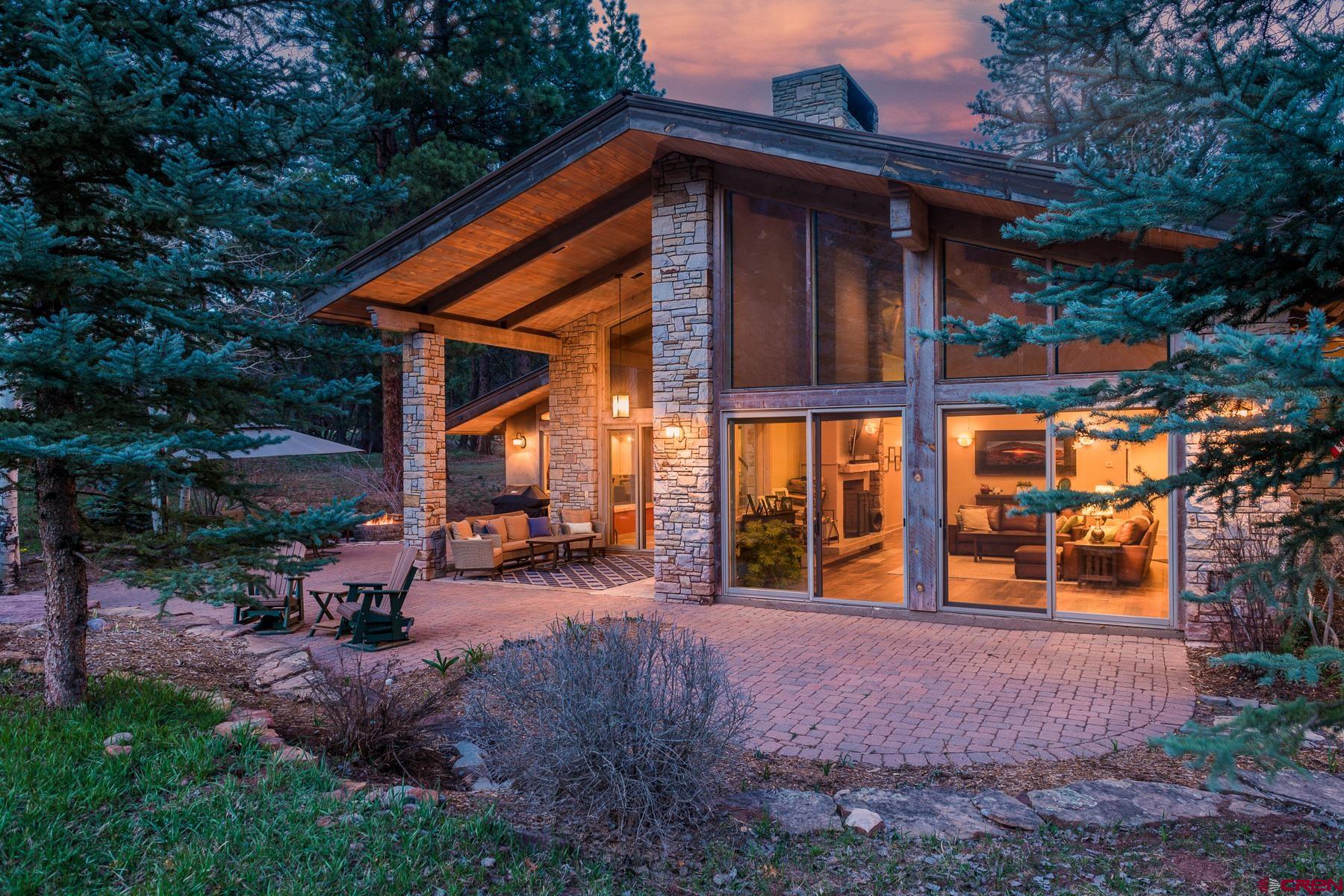 47 Mason Cabin Road Durango, CO 81301 - Photo 7 of 35 a backyard of a house with wooden fence and large trees